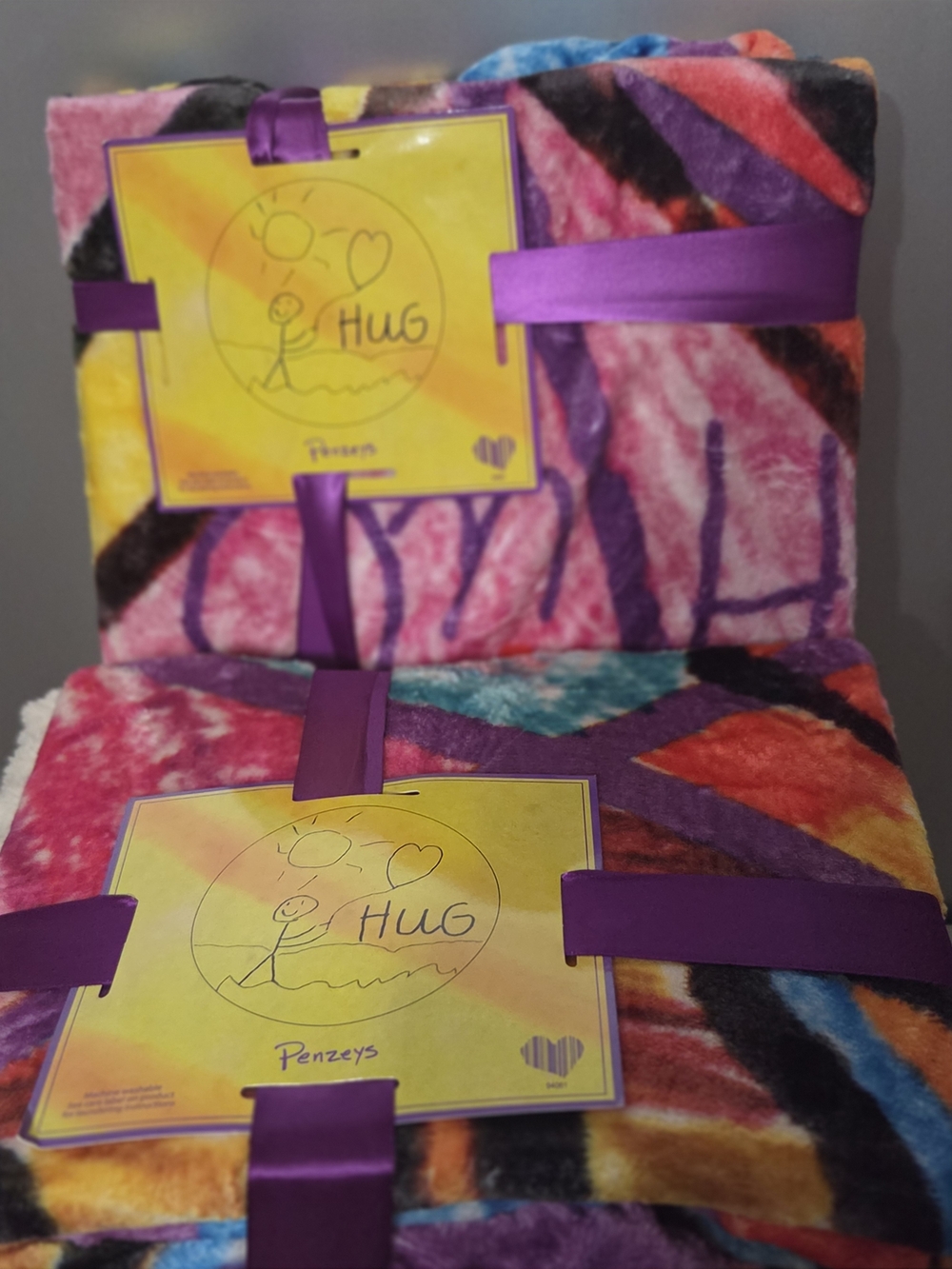 2 UNOPENED PENZEYS HUG BLANKETS.